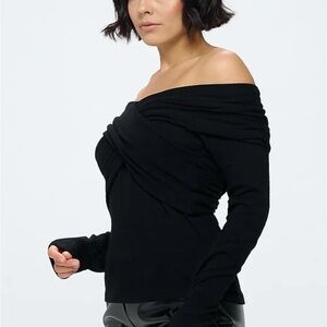 Reneec.New w/tags Black Long Sleeve off-shoulder wrap. Wear on or off shoulders.